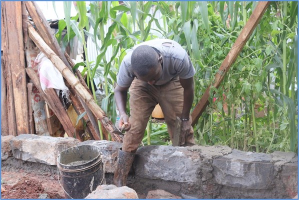 Mixing mortar to lay the foundation of the new home.