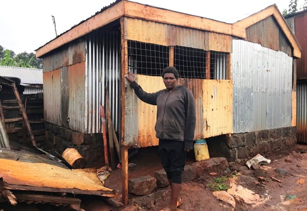 The new iron-sheet house takes shape.