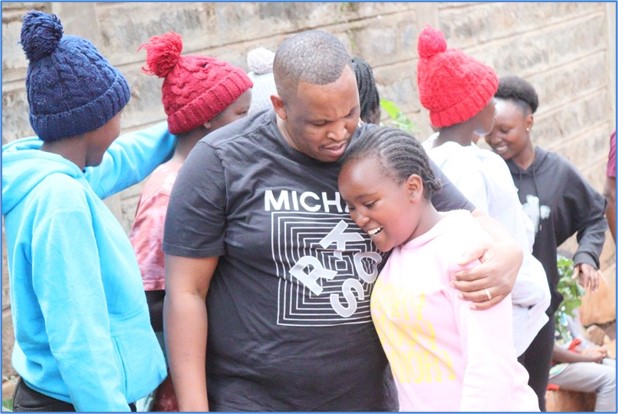 A mentor offers comfort and encouragement to a young person.