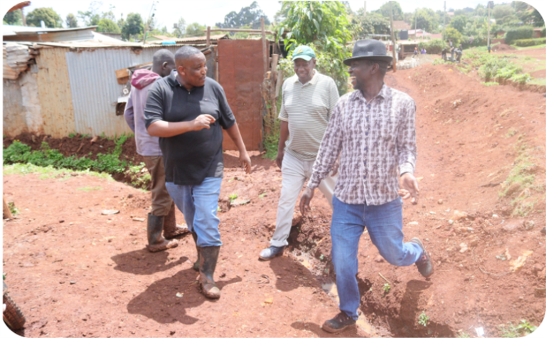 Walking through Gitaru Ward to see the work firsthand.