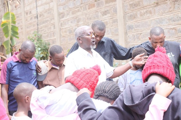 An elder shares wisdom with the young people he supports.