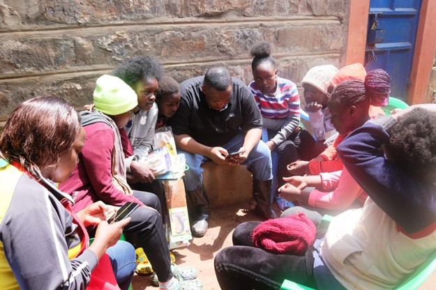 Sharing food and supplies with the beneficiaries.