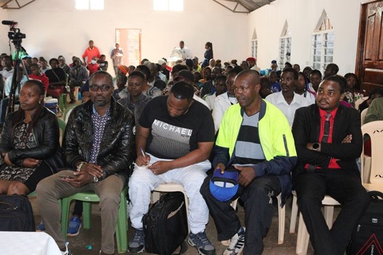 Young people listen and take part in the discussion.
