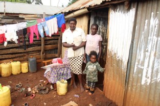 Veronica's family outside their home.