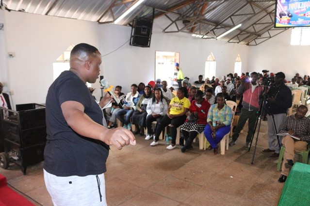 Addressing the crowd on the choices young people face.