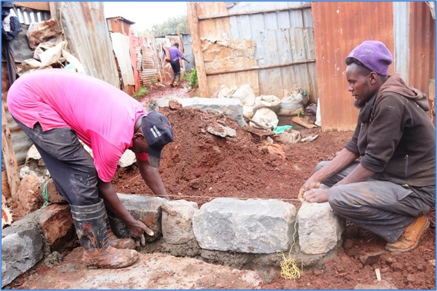 Laying the stone footings for the new home.
